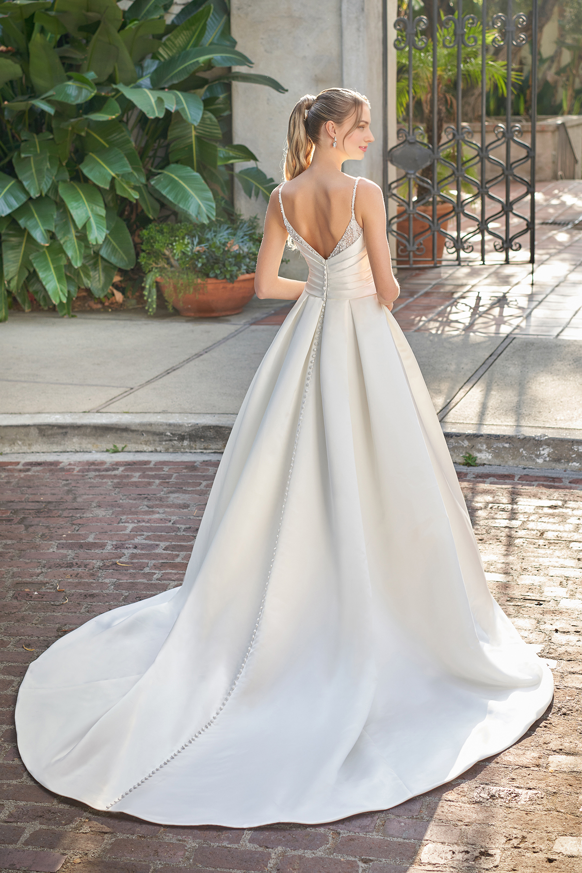 A-line V-neck sleeveless thin shoulder strap beaded backless and floor length wedding dress